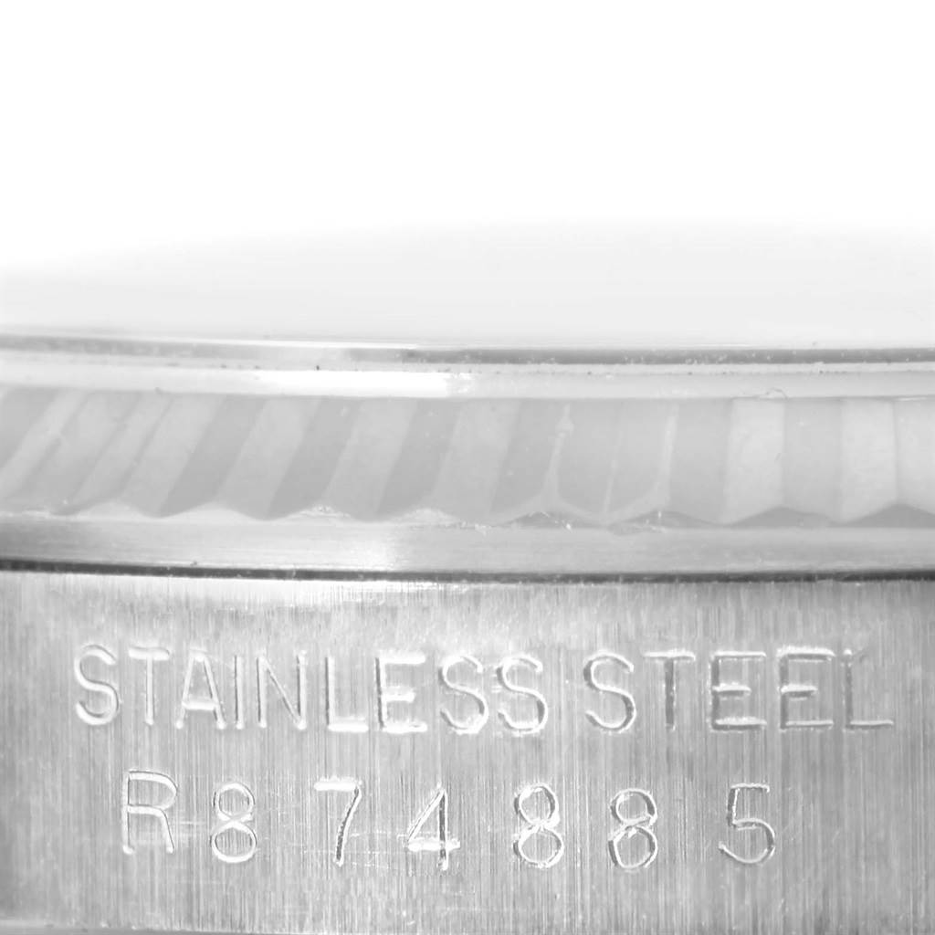 This close-up image of the Rolex Datejust 16234 Men's Stainless Steel Silver Dial 16234 Men's Stainless Steel Silver Dial watch shows the side engraving on the stainless steel case.