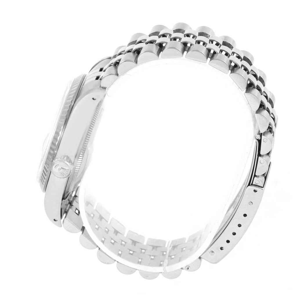 The image shows a side view of the Rolex Datejust 16234 Men's Stainless Steel Silver Dial 16234 Men's Stainless Steel Silver Dial watch, highlighting its case, crown, and jubilee bracelet.