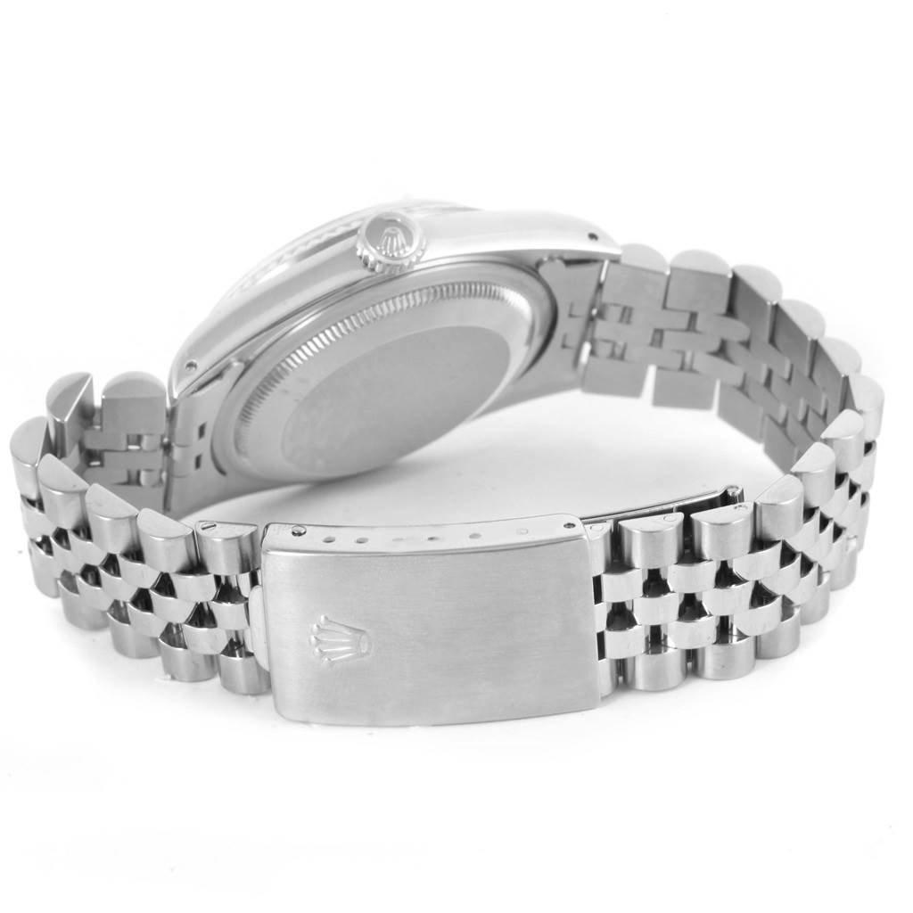 This image shows the back case, crown, and bracelet clasp of a Rolex Datejust 16234 Men's Stainless Steel Silver Dial 16234 Men's Stainless Steel Silver Dial watch.