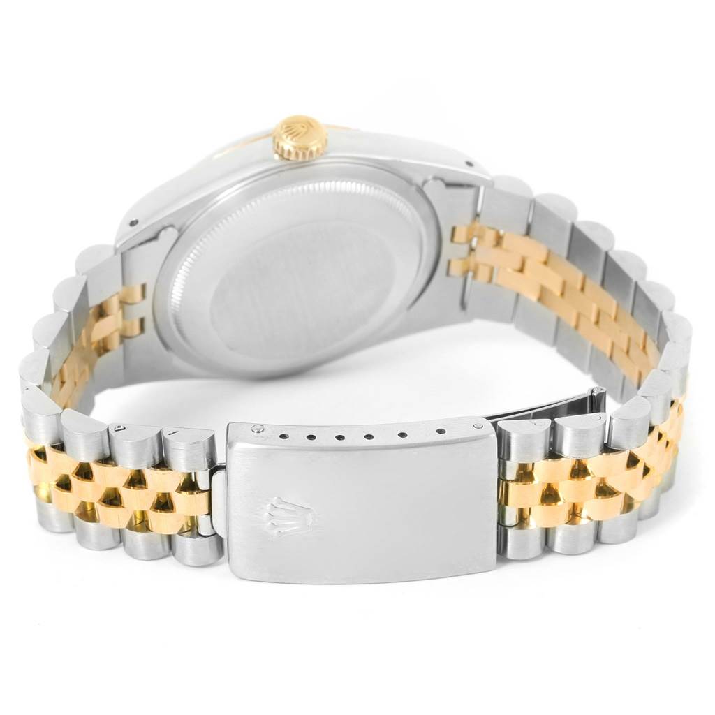 The Rolex Datejust 16233 Men's Steel and Gold (two tone) Black Dial 16233 Men's Steel and Gold (two tone) Black Dial watch is shown from the back, focusing on the case, crown, and two-tone bracelet with clasp.