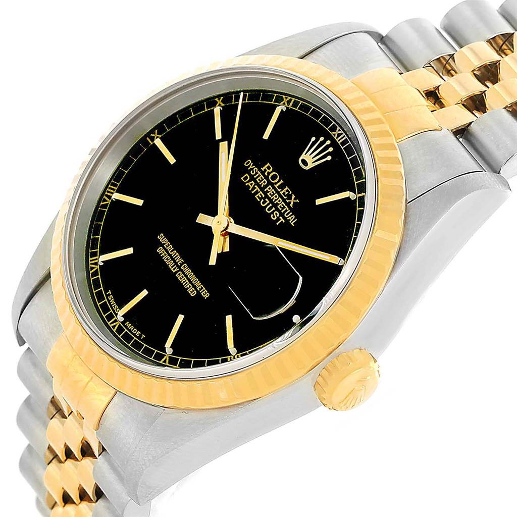 This image shows a Rolex Datejust 16233 Men's Steel and Gold (two tone) Black Dial 16233 Men's Steel and Gold (two tone) Black Dial watch at an angle focusing on the dial, bezel, crown, and part of the bracelet.