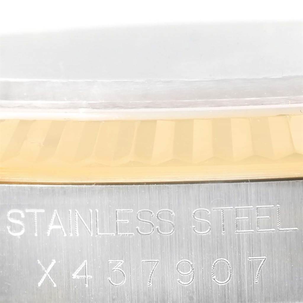 The image shows a close-up view of a Rolex Datejust 16233 Men's Steel and Gold (two tone) Beige Dial 16233 Men's Steel and Gold (two tone) Beige Dial watch, highlighting the serial number and the "STAINLESS STEEL" marking on the case.