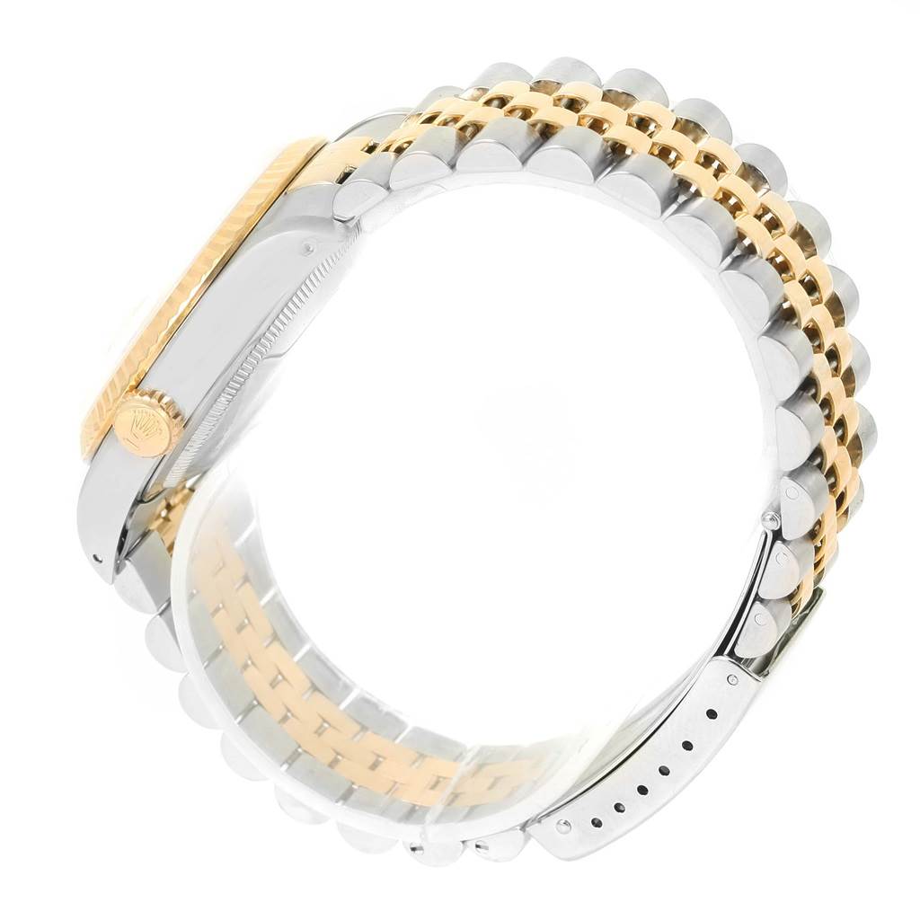 The image shows a side view of the Rolex Datejust 16233 Men's Steel and Gold (two tone) Beige Dial 16233 Men's Steel and Gold (two tone) Beige Dial, focusing on its crown, bezel, and two-tone bracelet.