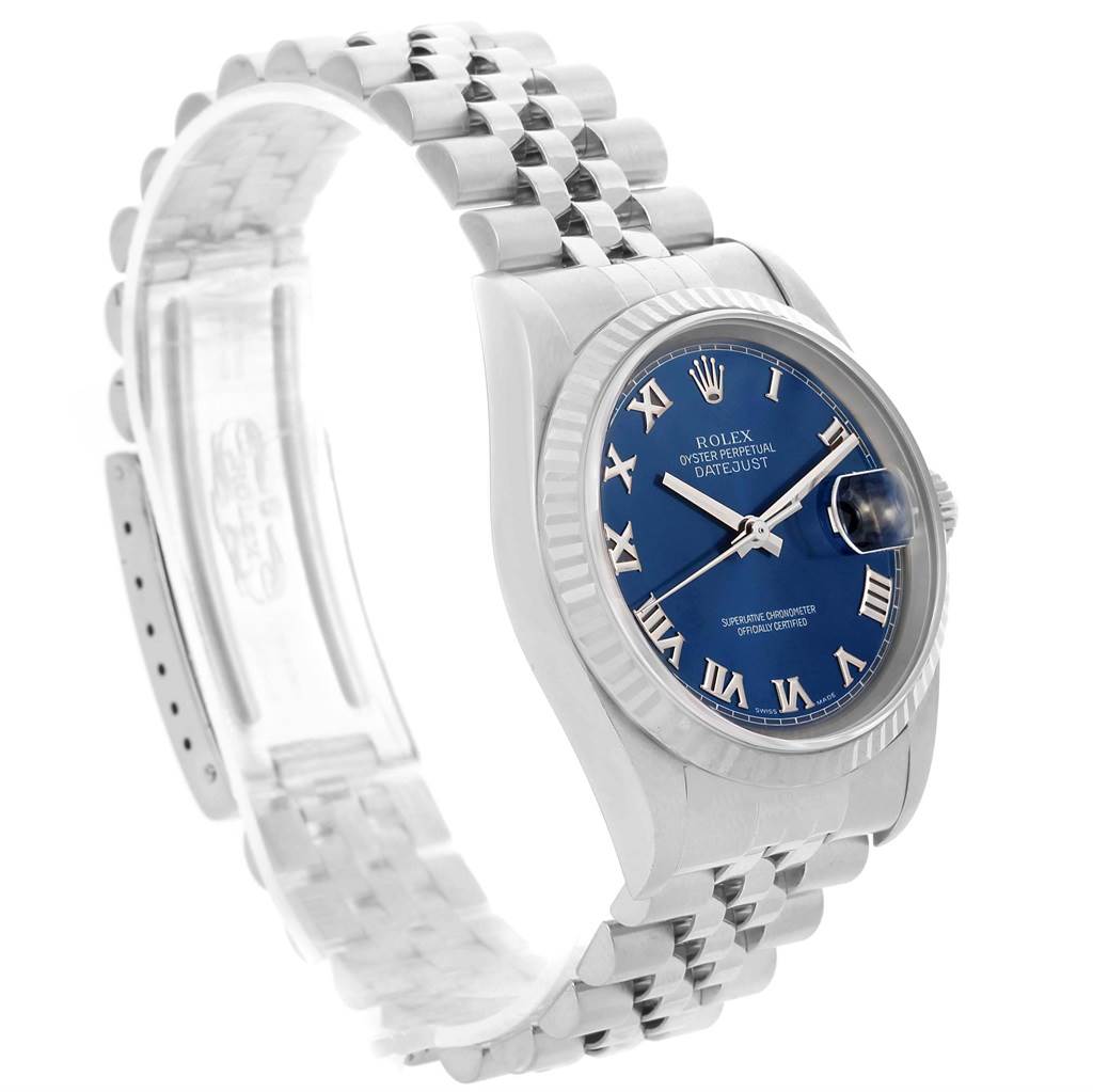 The image shows a side-angle view of a Rolex Datejust 16234 Men's Stainless Steel Blue Dial 16234 Men's Stainless Steel Blue Dial watch focusing on its blue dial, fluted bezel, and Jubilee bracelet.