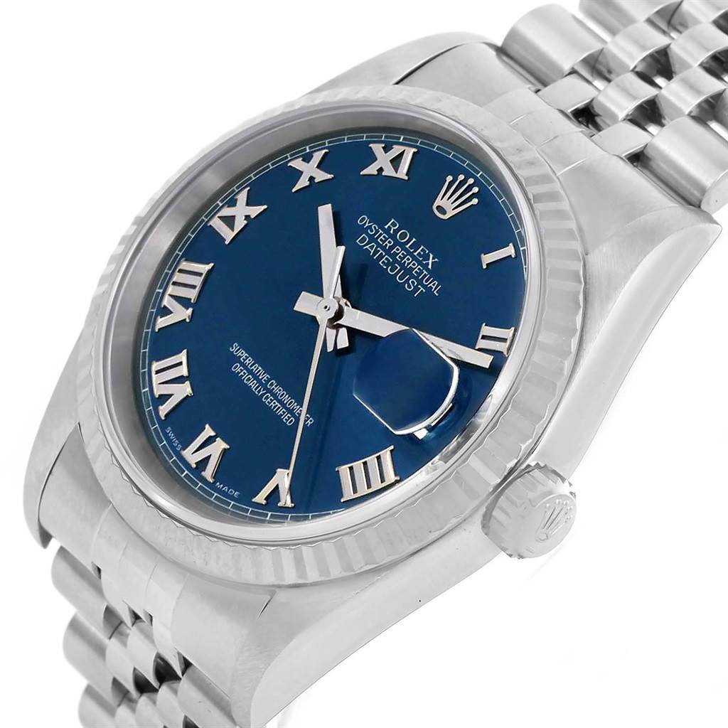This image shows a close-up of a Rolex Datejust 16234 Men's Stainless Steel Blue Dial 16234 Men's Stainless Steel Blue Dial watch, highlighting its blue dial, Roman numerals, crown, and part of the bracelet.