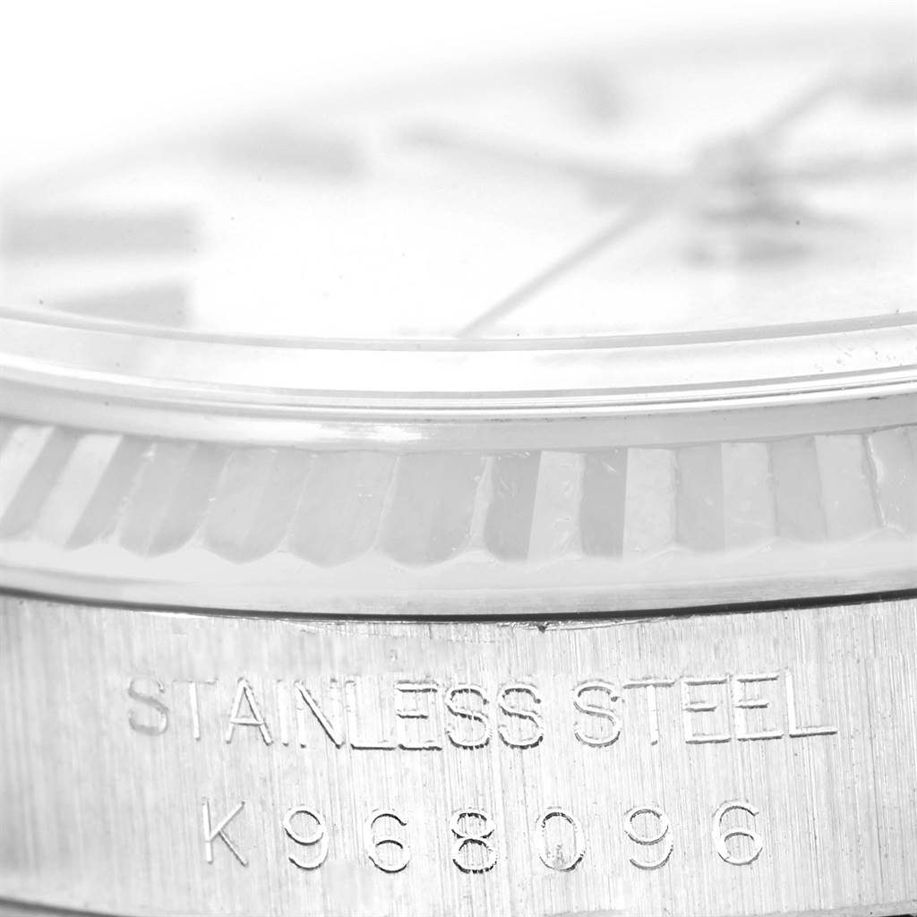 The image shows a close-up of the case
s edge, bezel, and part of the dial of a Rolex Datejust 16234 Men
s Stainless Steel White Dial 16234 Men
s Stainless Steel White Dial stainless steel watch.