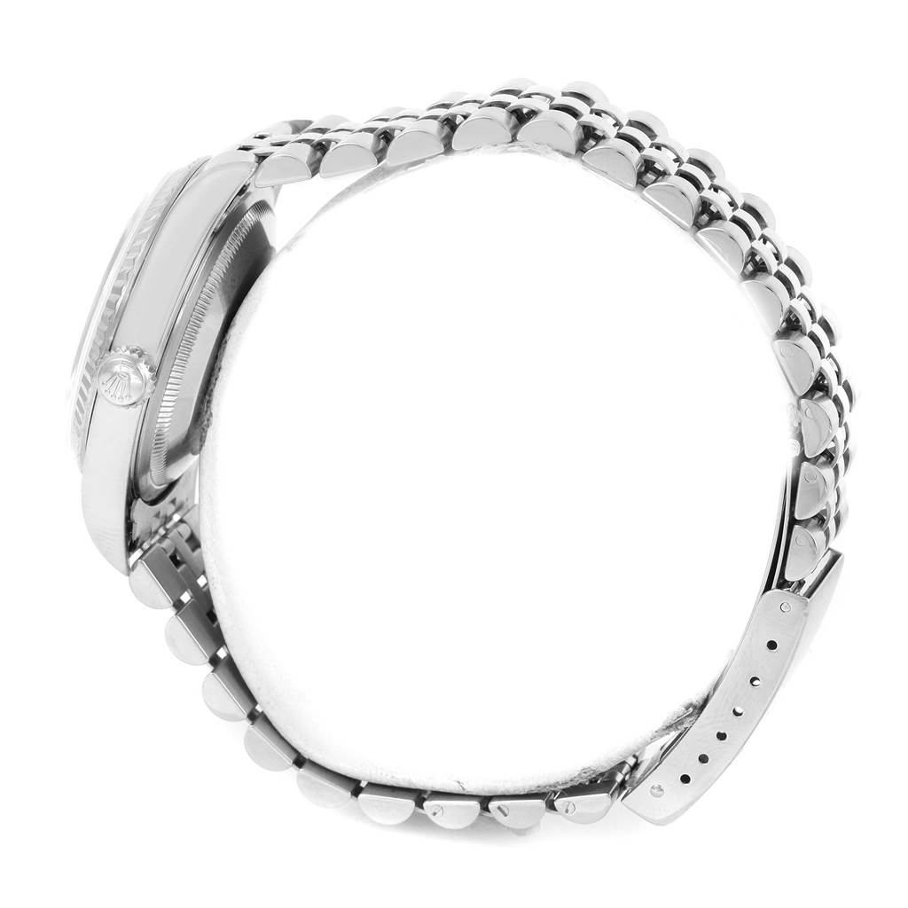 The image shows a side profile of a Rolex Datejust 16234 Men
s Stainless Steel White Dial 16234 Men
s Stainless Steel White Dial watch, focusing on the crown, case, and bracelet.