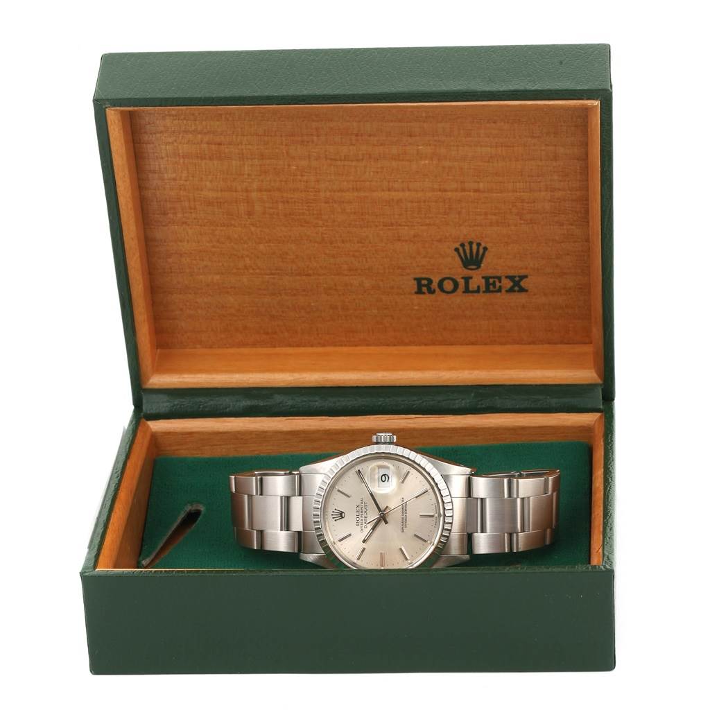 The Rolex Datejust 16030 Men's Stainless Steel Silver Dial 16030 Men's Stainless Steel Silver Dial watch is displayed frontally in an open green and wood-tone box.