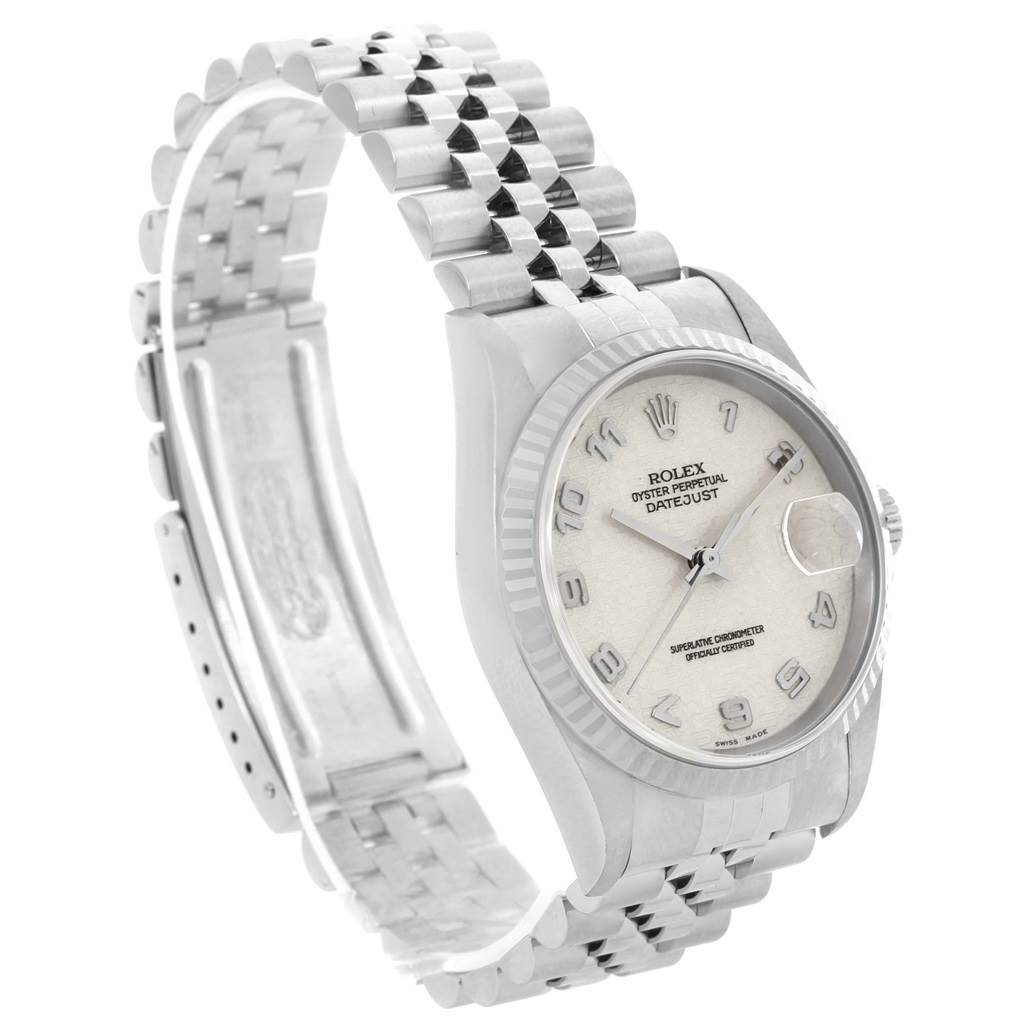 The image shows a side angle of the Rolex Datejust 16234 Men's Stainless Steel Silver Dial 16234 Men's Stainless Steel Silver Dial watch, highlighting the face, bezel, crown, and bracelet.