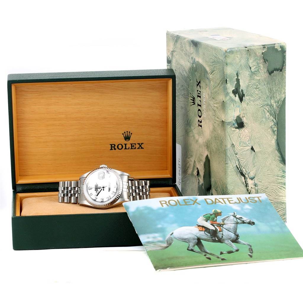 This image shows a Rolex Datejust 16234 Men's Stainless Steel White Dial 16234 Men's Stainless Steel White Dial watch with its open box, outer case, and a Datejust brochure.
