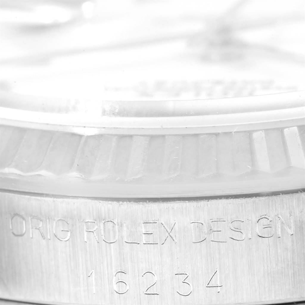 The image shows a close-up of the bezel and case side of the Rolex Datejust 16234 Men's Stainless Steel White Dial 16234 Men's Stainless Steel White Dial, highlighting the engraved model number 16234.