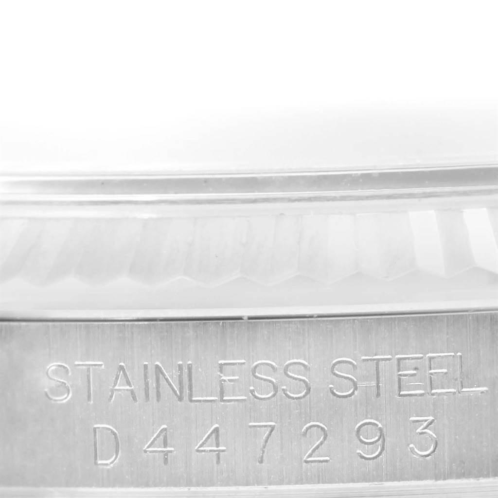 The image shows a close-up of the stainless steel engraving and serial number on a Rolex Datejust 116234 Men
s Stainless Steel Black Dial 116234 Men
s Stainless Steel Black Dial watch.
