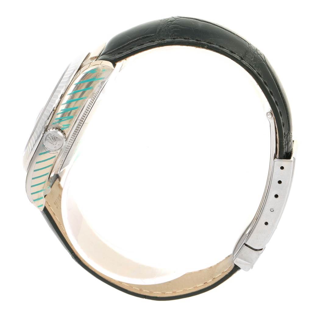 This side view shows the case, bezel, crown, and strap of a Rolex Datejust 116139 Men's White Gold Blue Dial 116139 Men's White Gold Blue Dial watch.