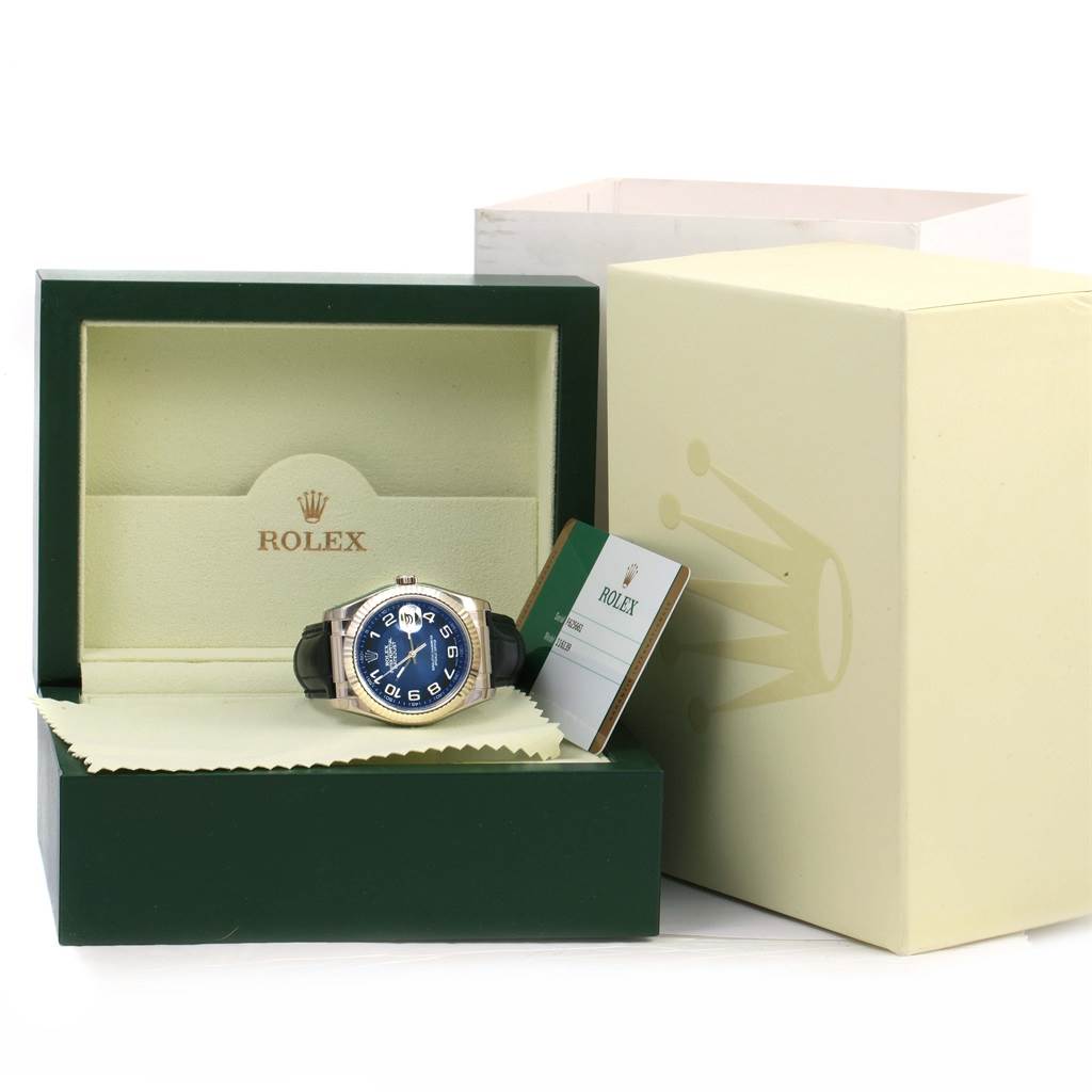 The image shows a Rolex Datejust 116139 Men's White Gold Blue Dial 116139 Men's White Gold Blue Dial watch with a blue dial in its green box, alongside official documents and outer packaging.