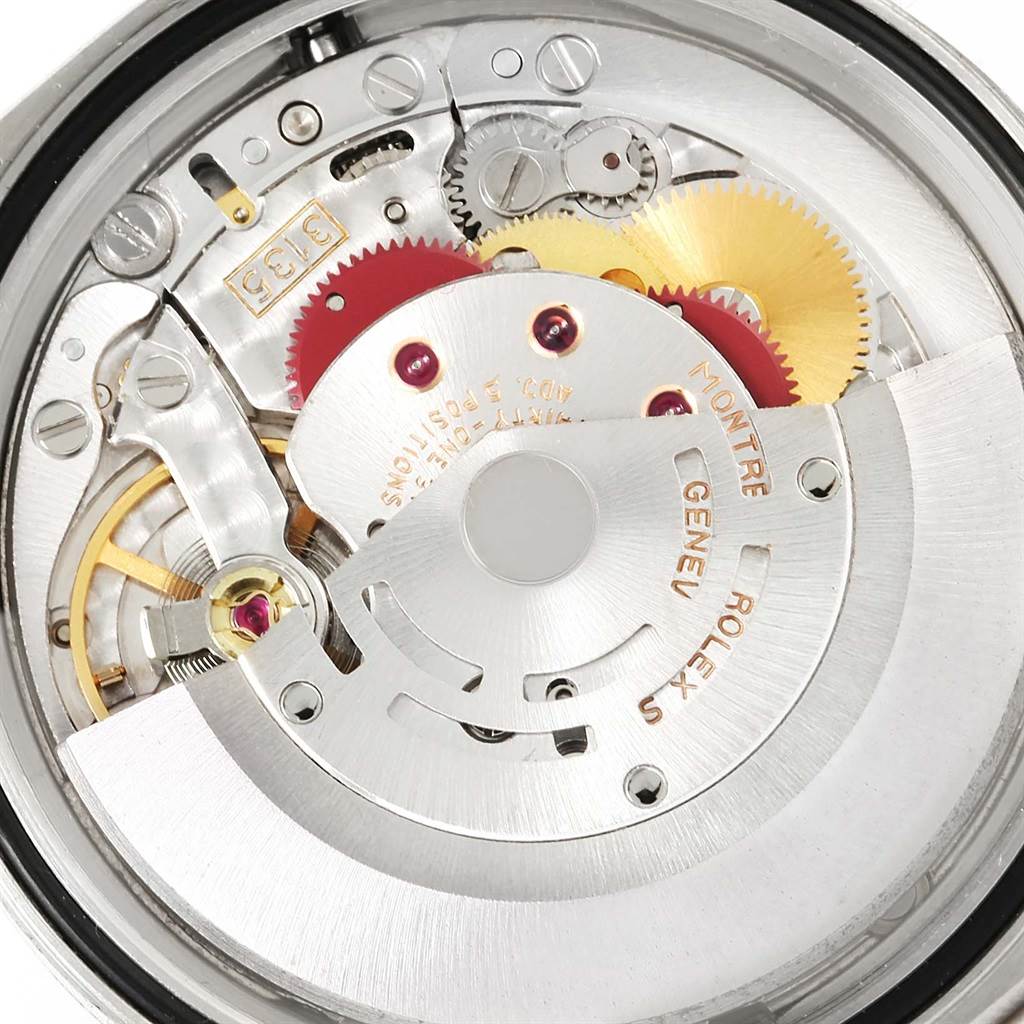 This image shows a close-up of the internal mechanical parts of a Rolex Datejust 16233 Men's Steel and Gold (two tone) Black Dial 16233 Men's Steel and Gold (two tone) Black Dial watch.