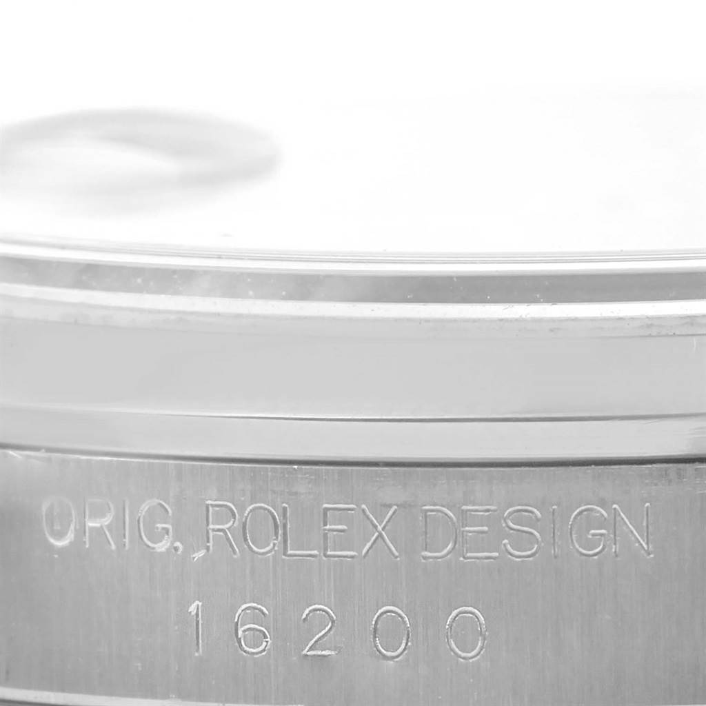 This image shows a close-up angle of the side of a Rolex Datejust 16200 Men's Stainless Steel Blue Dial 16200 Men's Stainless Steel Blue Dial watch, focusing on the text "Orig. Rolex Design 16200."