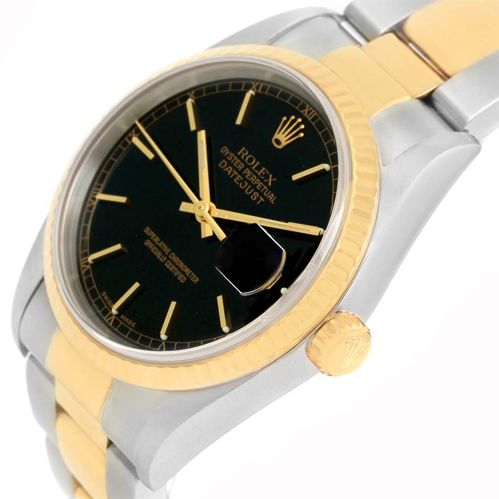 This image shows a close-up, angled view of the Rolex Datejust 16233 Men's Steel and Gold (two tone) Black Dial 16233 Men's Steel and Gold (two tone) Black Dial watch, highlighting its dial, bezel, crown, and part of the bracelet.