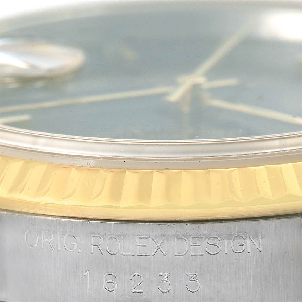 This image shows a close-up of the side of a Rolex Datejust 16233 Men's Steel and Gold (two tone) Black Dial 16233 Men's Steel and Gold (two tone) Black Dial watch, highlighting its bezel and engraved model number.