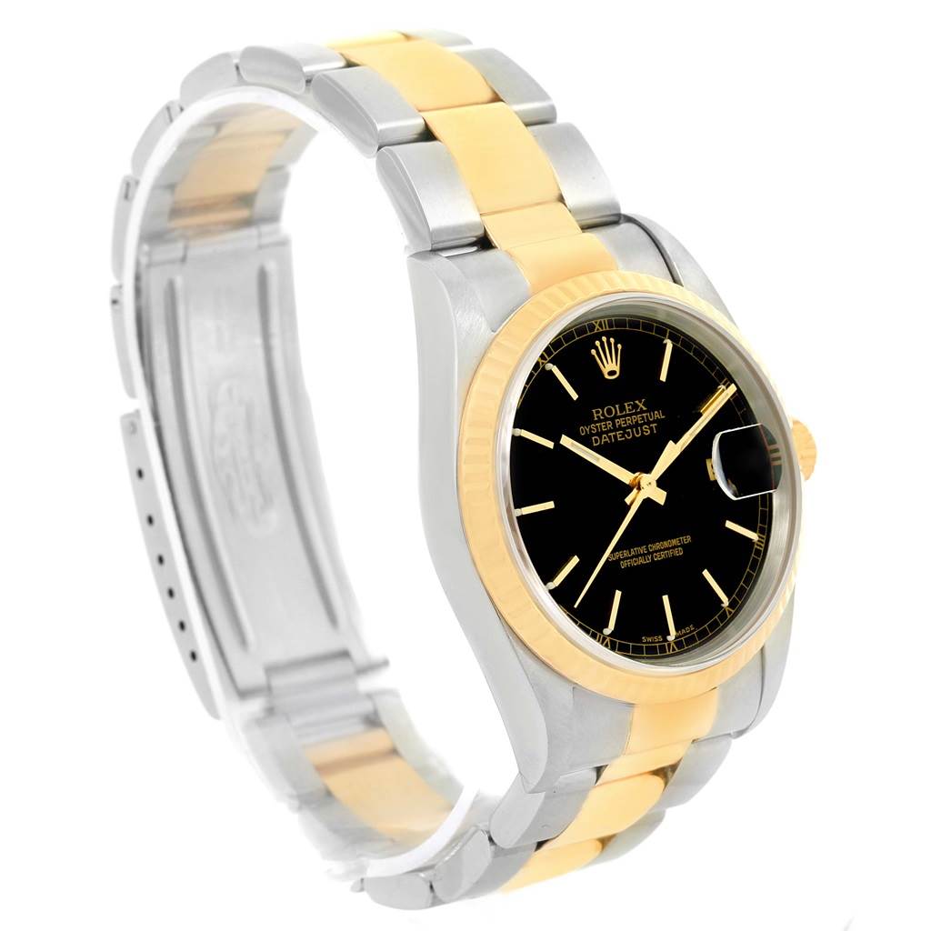 The image shows a Rolex Datejust 16233 Men's Steel and Gold (two tone) Black Dial 16233 Men's Steel and Gold (two tone) Black Dial watch at an angled side view, highlighting its two-tone bracelet, black dial, and Cyclops date window.