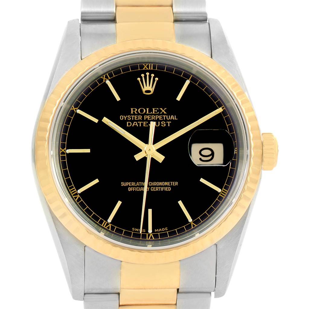 This image shows the front face of a Rolex Datejust 16233 Men's Steel and Gold (two tone) Black Dial 16233 Men's Steel and Gold (two tone) Black Dial watch, highlighting its black dial, gold accents, and the date window.