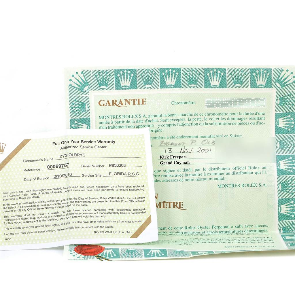 The image shows warranty and service papers for a Rolex Datejust 16233 Men's Steel and Gold (two tone) Black Dial 16233 Men's Steel and Gold (two tone) Black Dial model, including a green warranty card and documents with text and logos.