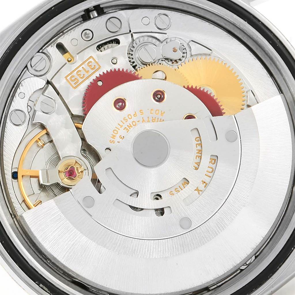 This image shows the movement mechanism and internal components of the Rolex Datejust 16233 Men's Steel and Gold (two tone) Blue Dial 16233 Men's Steel and Gold (two tone) Blue Dial watch from a close-up angle.