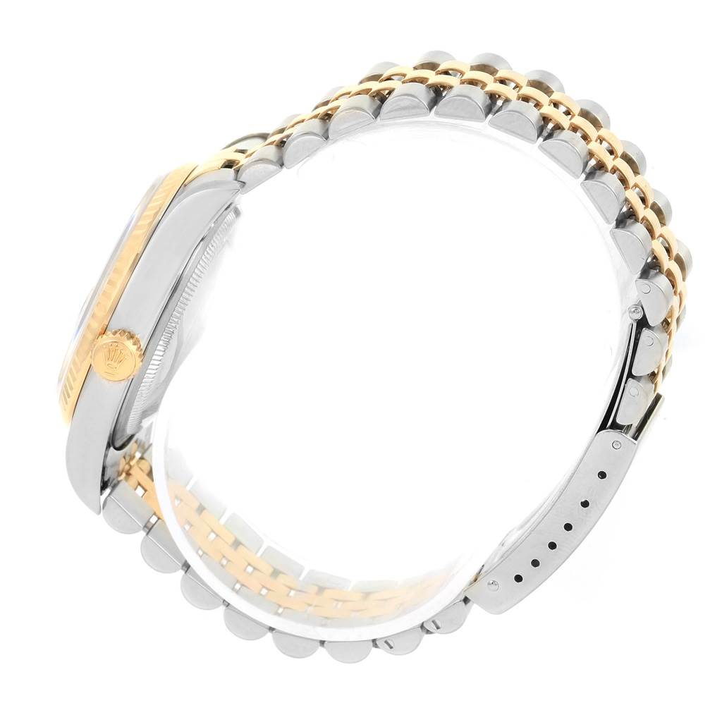 This image shows a side view of a Rolex Datejust 16233 Men's Steel and Gold (two tone) Blue Dial 16233 Men's Steel and Gold (two tone) Blue Dial, focusing on its two-tone bracelet and crown.