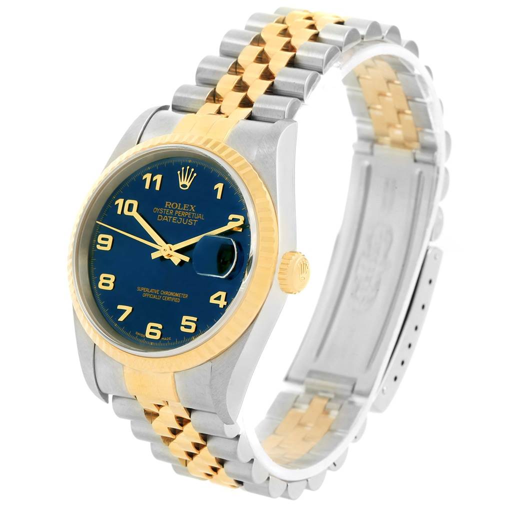 The image shows a Rolex Datejust 16233 Men's Steel and Gold (two tone) Blue Dial 16233 Men's Steel and Gold (two tone) Blue Dial watch at a 3/4 angle, featuring a blue dial, two-tone bracelet, and fluted bezel.