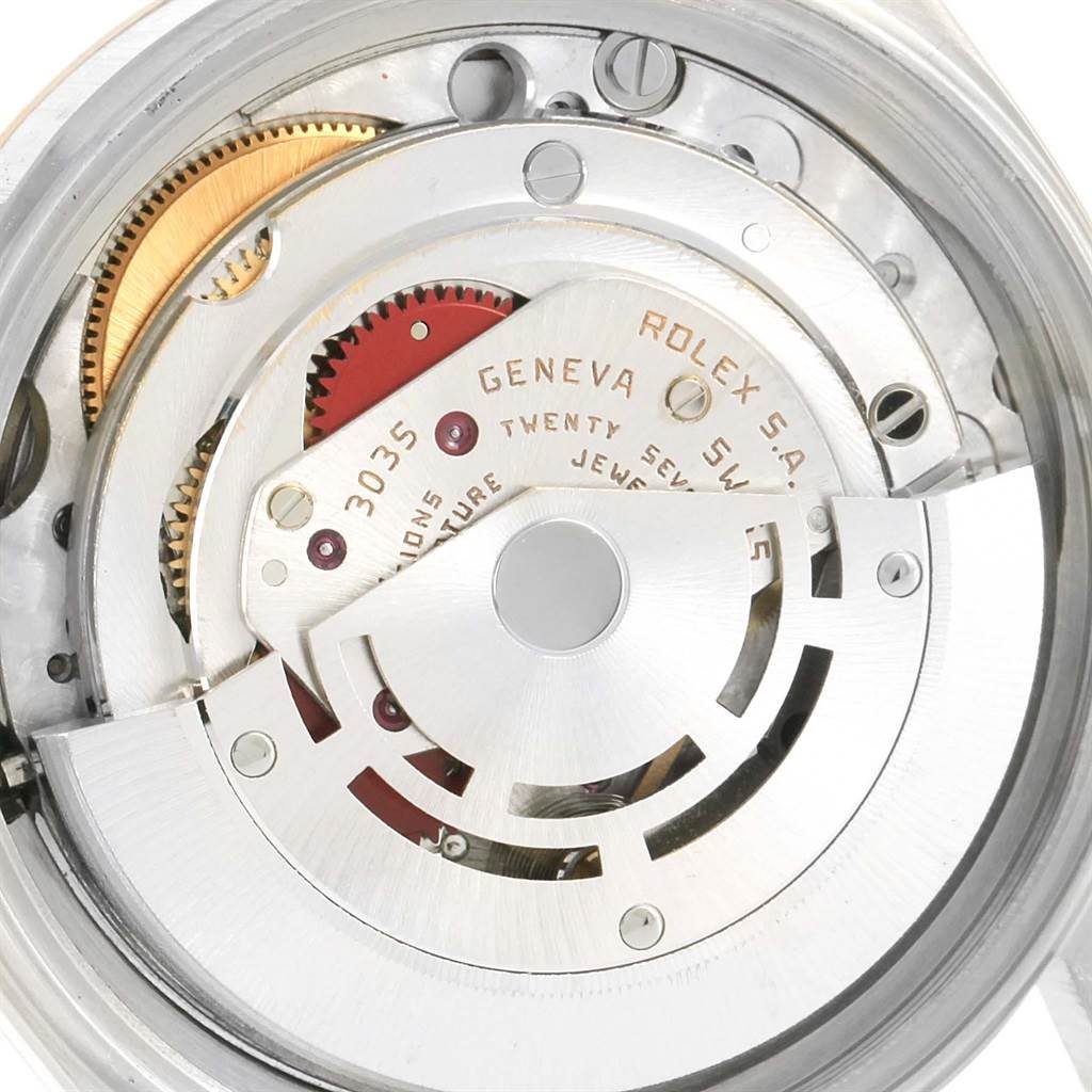 This image shows a close-up of the movement mechanism inside a Rolex Datejust 16013 Men
s Stainless Steel Champagne Dial 16013 Men
s Stainless Steel Champagne Dial watch.