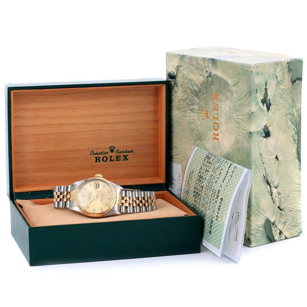 The Rolex Datejust 16013 Men
s Stainless Steel Champagne Dial 16013 Men
s Stainless Steel Champagne Dial watch is shown inside its open wooden box alongside the outer box and paperwork on the right.