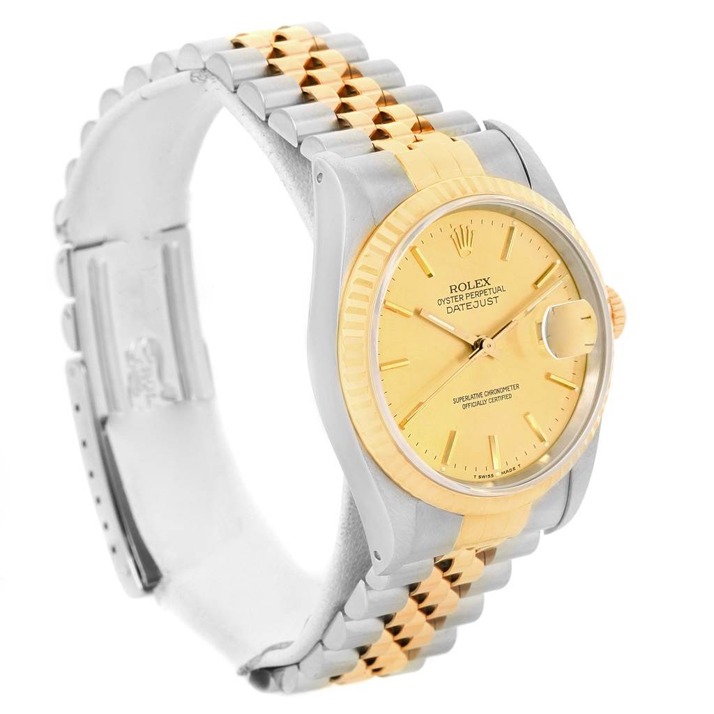 The Rolex Datejust 16233 Men's Steel and Gold (two tone) Champagne Dial 16233 Men's Steel and Gold (two tone) Champagne Dial watch is shown at a three-quarter angle, highlighting its gold dial, bezel, and two-tone bracelet.