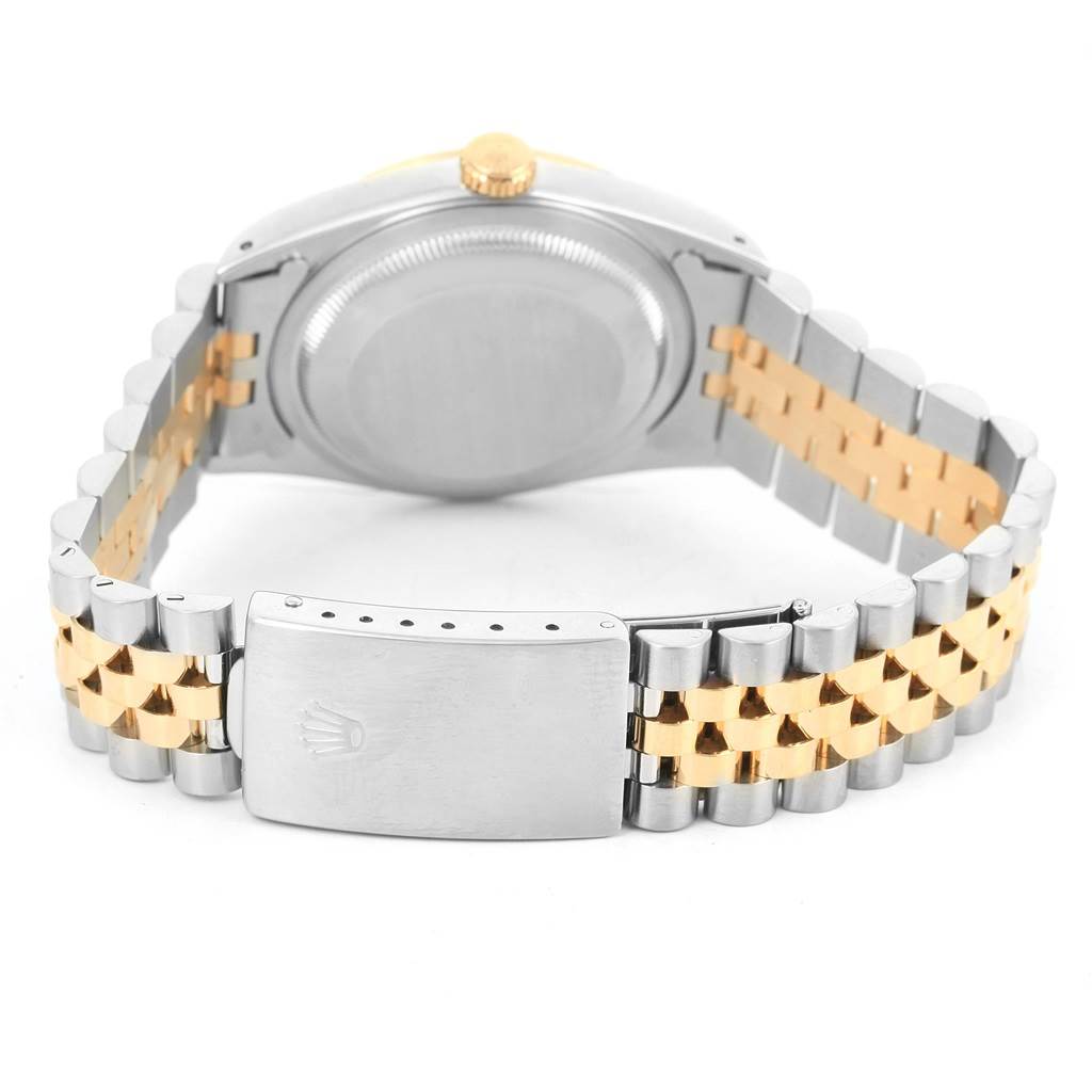 The image shows the back view of a Rolex Datejust 16233 Men's Steel and Gold (two tone) Champagne Dial 16233 Men's Steel and Gold (two tone) Champagne Dial watch, highlighting the case back, crown, and two-tone bracelet.