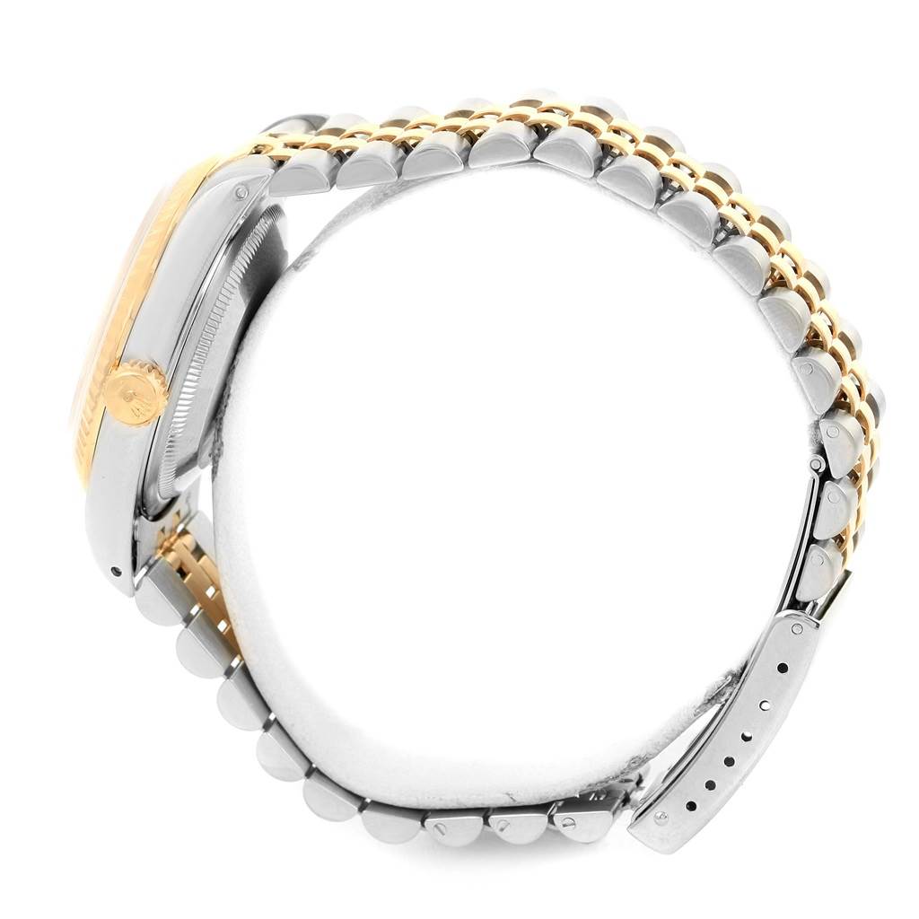 The image shows the side view of a Rolex Datejust 16233 Men's Steel and Gold (two tone) Champagne Dial 16233 Men's Steel and Gold (two tone) Champagne Dial watch, highlighting the bracelet and crown.