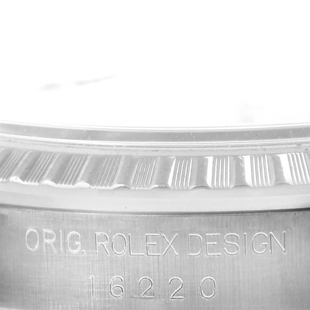 The image shows a close-up of the Rolex Datejust 16220 Men's Stainless Steel Silver Dial 16220 Men's Stainless Steel Silver Dial watch bezel and the engraved model number "16220".