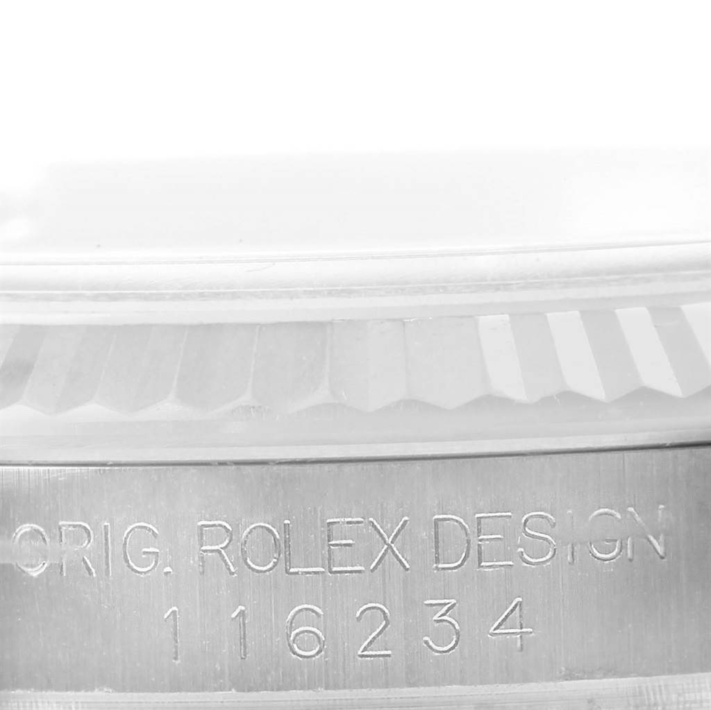 This is a close-up of the case side and bezel of a Rolex Datejust 116234 Men's Stainless Steel Blue Dial 116234 Men's Stainless Steel Blue Dial watch, showing the model number and "Orig. Rolex Design" engraving.