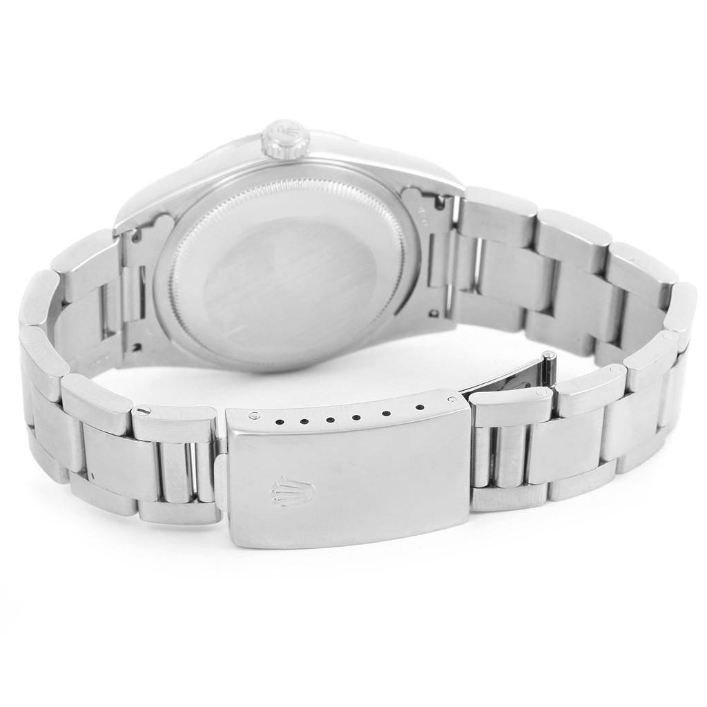 This image shows the back case, bracelet, and clasp of a Rolex Datejust 16220 Men's Stainless Steel Blue Dial 16220 Men's Stainless Steel Blue Dial watch.