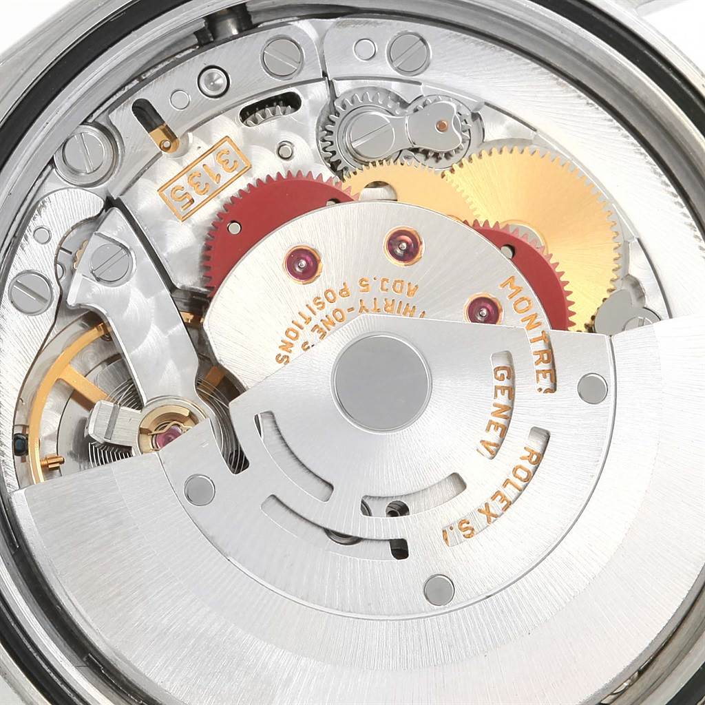 This close-up image shows the intricate internal movement components of the Rolex Datejust 16220 Men's Stainless Steel Blue Dial 16220 Men's Stainless Steel Blue Dial watch.