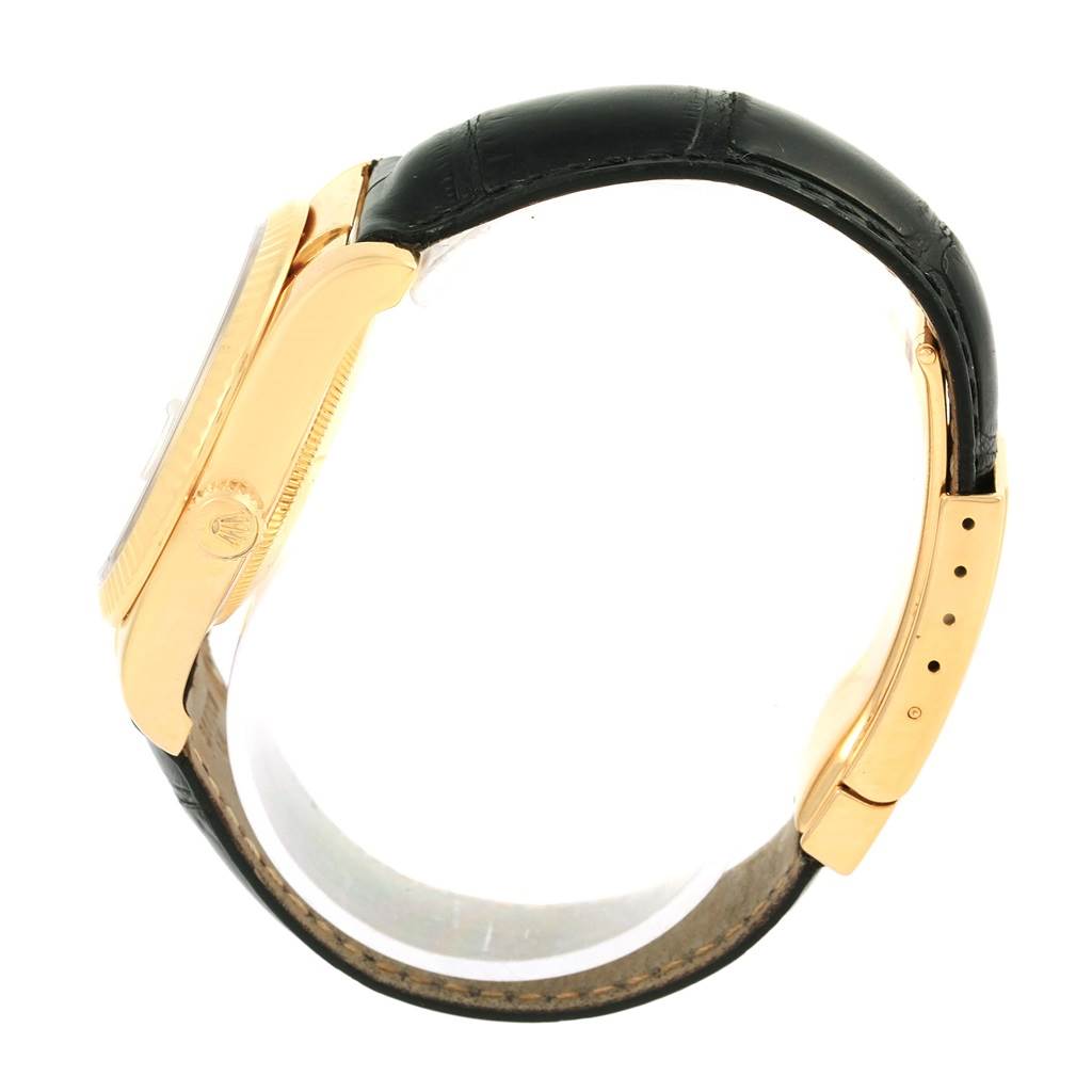 This image shows a side view of the Rolex Datejust 116138 Men's Yellow Gold White Dial 116138 Men's Yellow Gold White Dial watch, highlighting the case, crown, bezel, and leather strap.