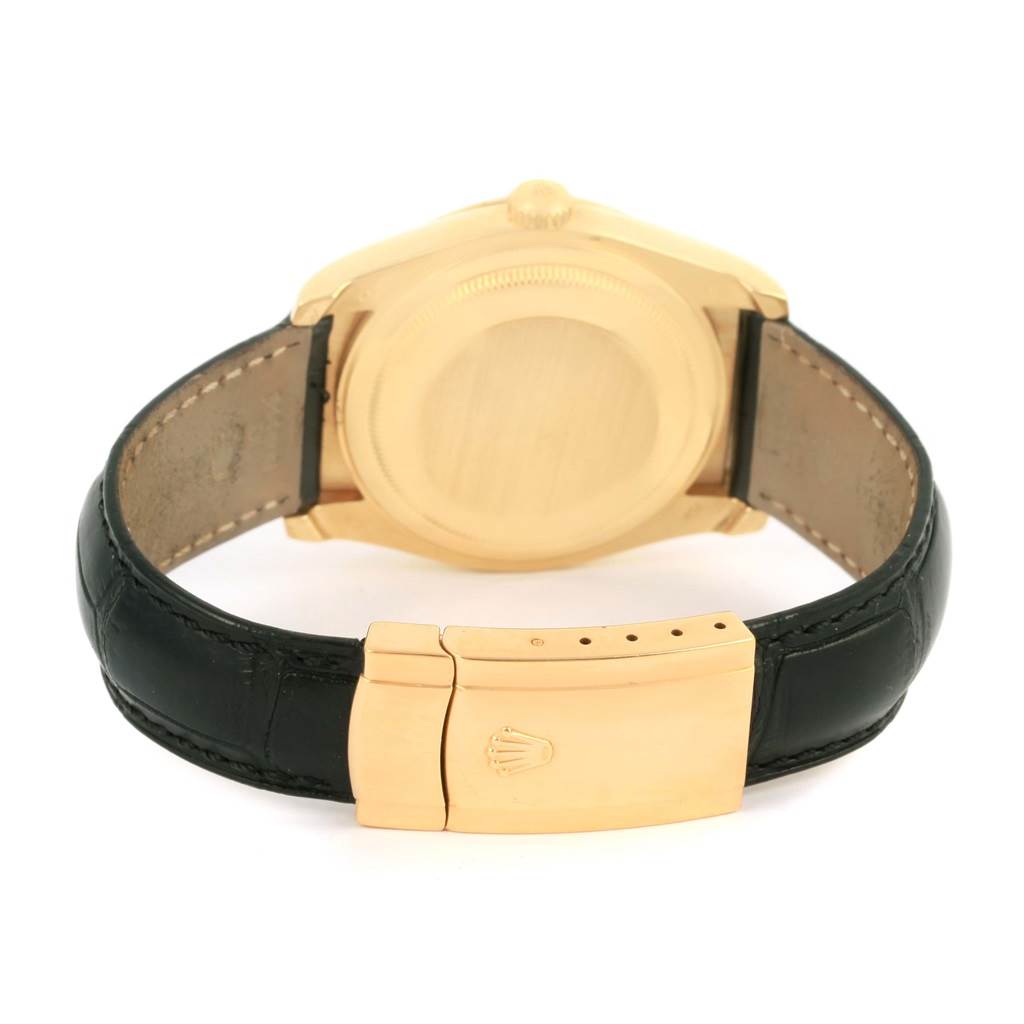 The image shows the rear view of a Rolex Datejust 116138 Men's Yellow Gold White Dial 116138 Men's Yellow Gold White Dial watch with a black strap and gold clasp.