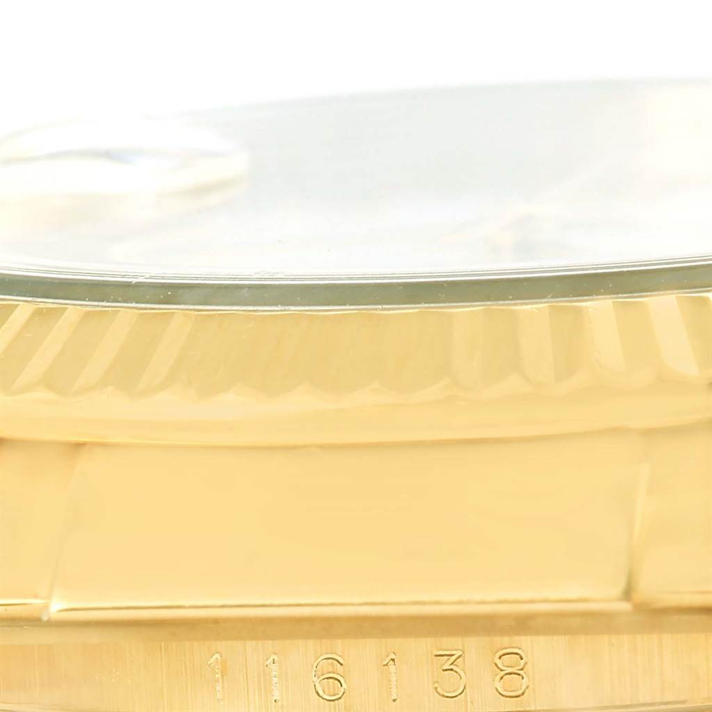This image shows a close-up angle of the side of the Rolex Datejust 116138 Men's Yellow Gold White Dial 116138 Men's Yellow Gold White Dial watch, displaying the bezel and model number 116138.