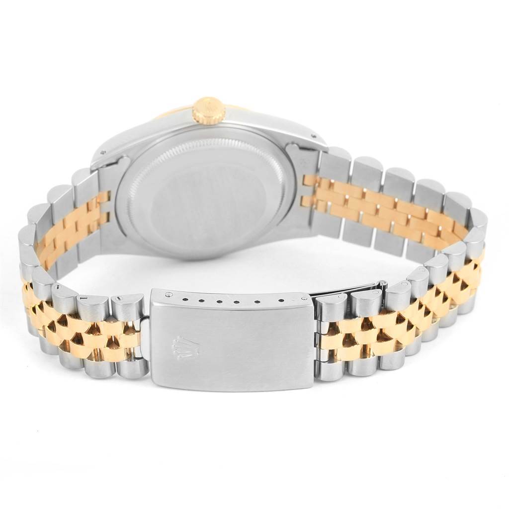 The image shows the back view of a Rolex Datejust 16233 Men
s Steel and Gold (two tone) Silver Dial 16233 Men
s Steel and Gold (two tone) Silver Dial watch highlighting the case back, crown, and two-tone bracelet with clasp.