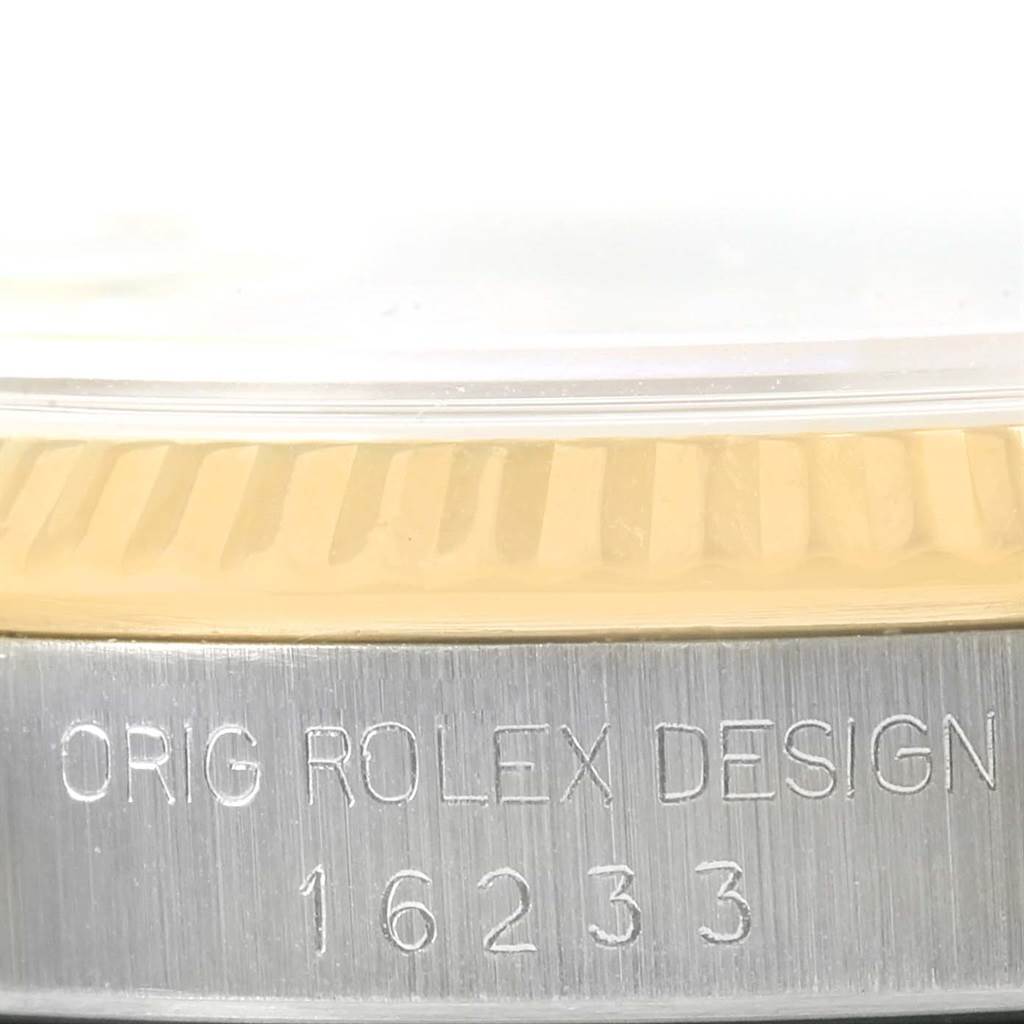 The image shows a close-up of the bezel and case side of a Rolex Datejust 16233 Men
s Steel and Gold (two tone) Silver Dial 16233 Men
s Steel and Gold (two tone) Silver Dial model, displaying the engraved model number 16233.