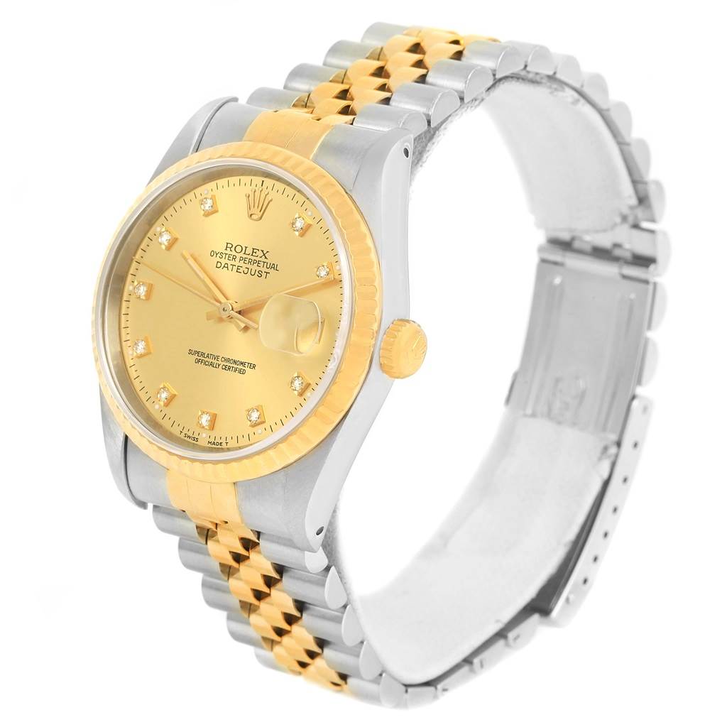 This image shows a Rolex Datejust 16233 Men
s Steel and Gold (two tone) Champagne Dial 16233 Men
s Steel and Gold (two tone) Champagne Dial watch angled to display its gold dial, bezel, crown, and bicolor bracelet.