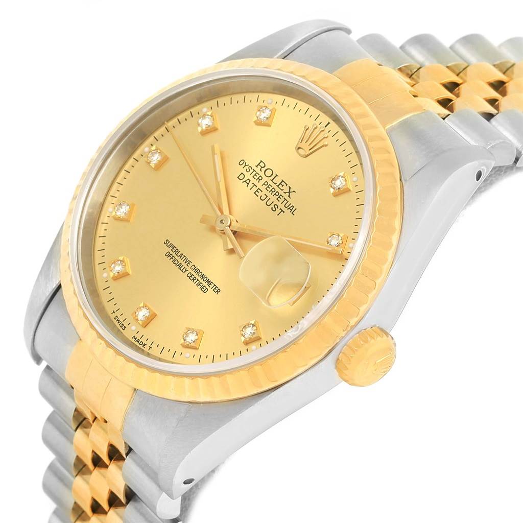 The image shows a close-up angle of a Rolex Datejust 16233 Men
s Steel and Gold (two tone) Champagne Dial 16233 Men
s Steel and Gold (two tone) Champagne Dial model, highlighting the dial, bezel, crown, and part of the bracelet.