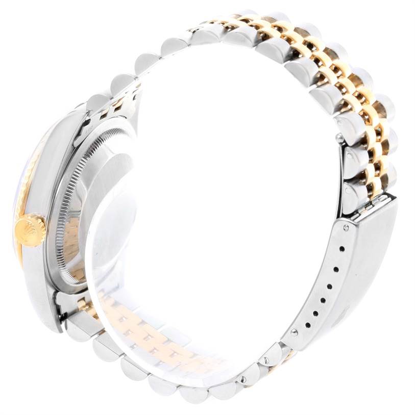 This image shows a side view of a Rolex Datejust 16233 Men's Steel and Gold (two tone) Black Dial 16233 Men's Steel and Gold (two tone) Black Dial watch, focusing on the crown, case, and jubilee bracelet.