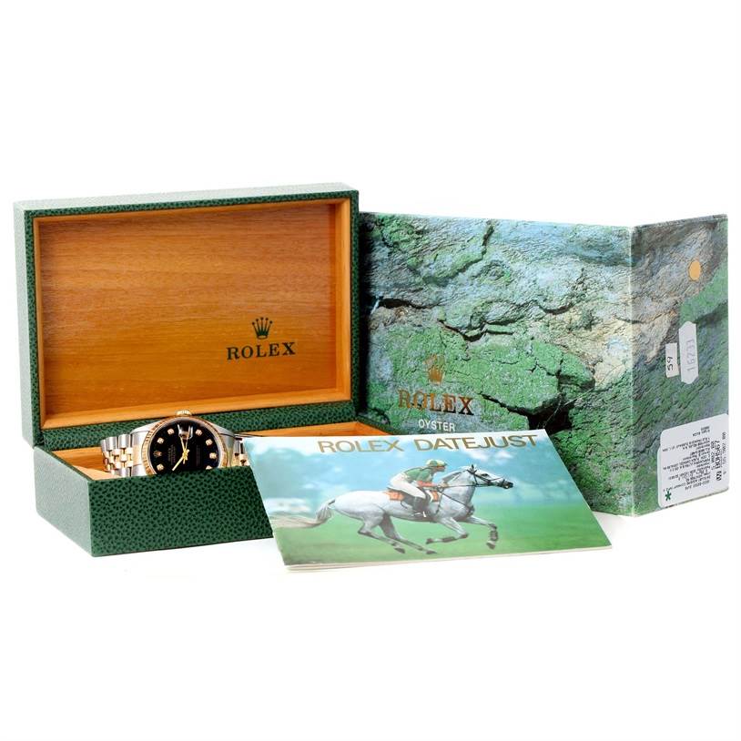 The image shows a Rolex Datejust 16233 Men's Steel and Gold (two tone) Black Dial 16233 Men's Steel and Gold (two tone) Black Dial watch, its green box open, and an instruction manual placed in front.