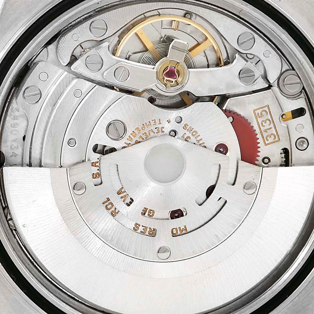 The image shows a close-up view of the movement mechanism of the Rolex Datejust 16234 Men
s Stainless Steel Black Dial 16234 Men
s Stainless Steel Black Dial watch.