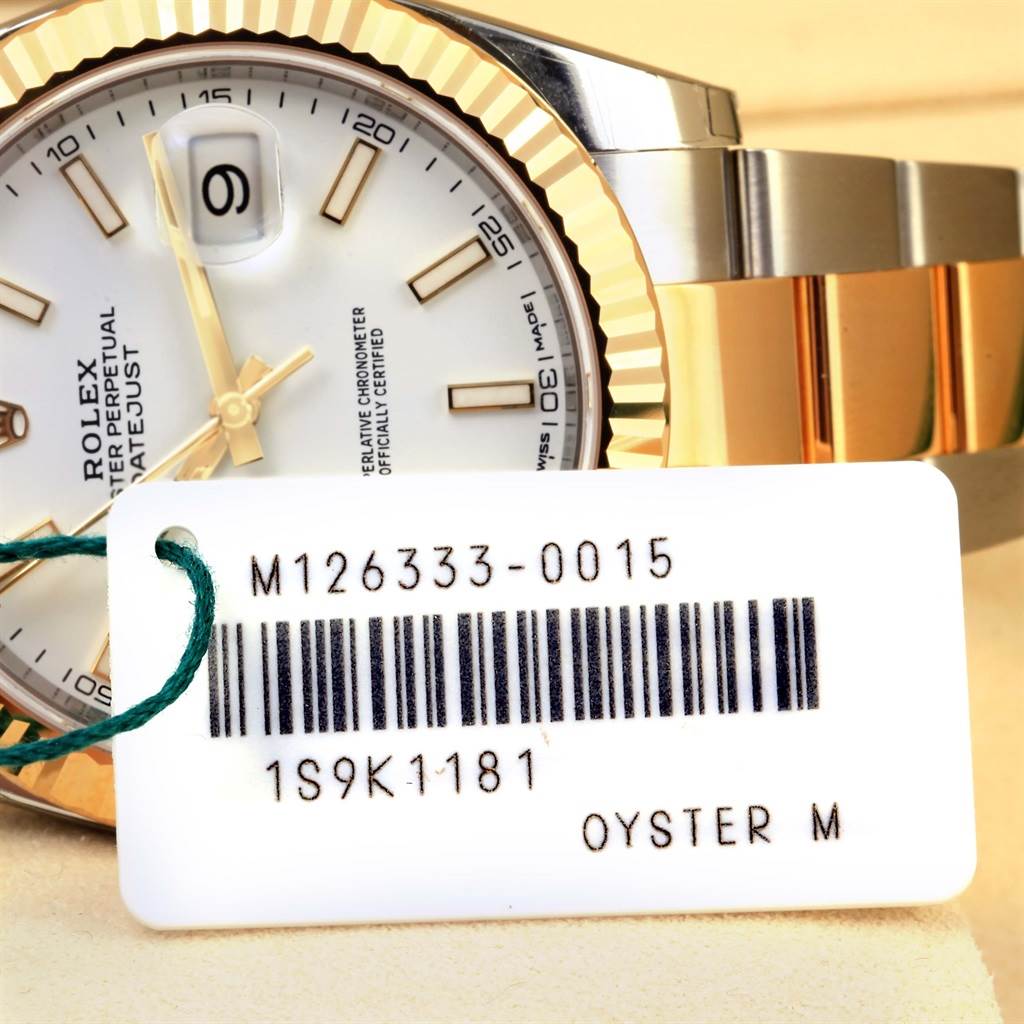 The image shows a close-up view of a Rolex Datejust 126333 Men's Steel and Gold (two tone) White Dial 126333 Men's Steel and Gold (two tone) White Dial watch face, partial bracelet, and a barcode tag.