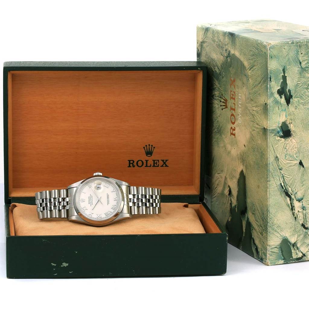 The Rolex Datejust 16200 Men's Stainless Steel Beige Dial 16200 Men's Stainless Steel Beige Dial watch is displayed in its open box with the case, dial, and bracelet visible, next to its outer packaging.
