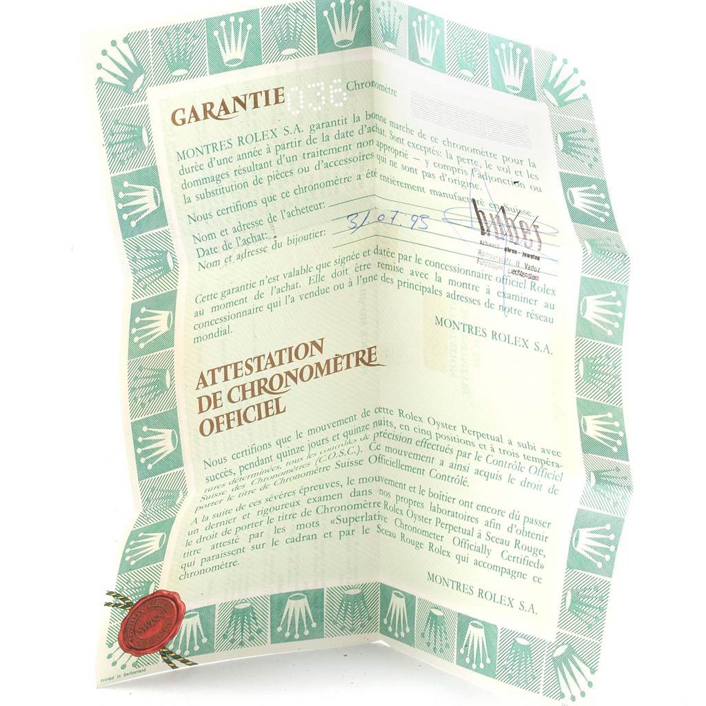 This image shows a warranty certificate for a Rolex Datejust 16200 Men's Stainless Steel Beige Dial 16200 Men's Stainless Steel Beige Dial watch at an angled view.